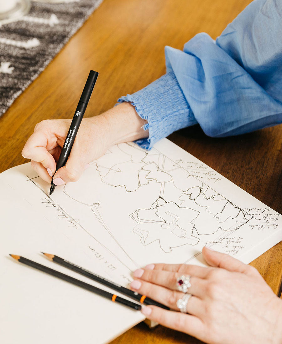 Madeleine sketching at table - Madeleine McKinlay Art